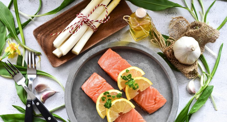 Fresh raw salmon fillets with lemon slices